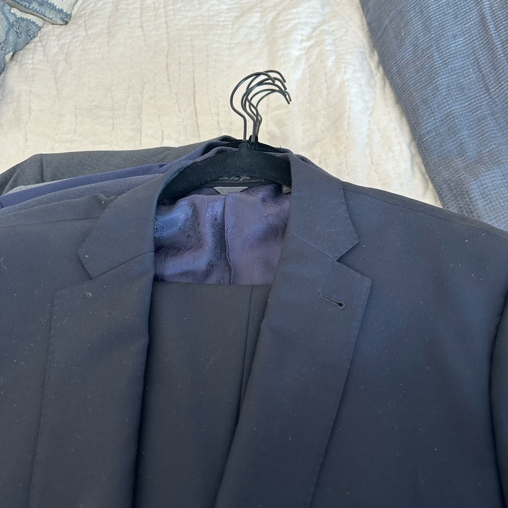 Elegant Black Suit with Notched Lapels and Smooth Finish